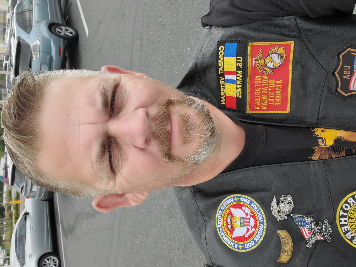 David Blaesing wearing a leather veterans vest with Marine Corps patches