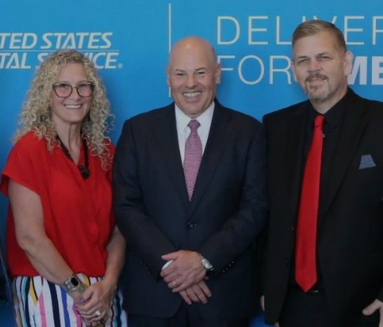 Amy Blaesing, Postmaster General Louis DeJoy, and David Blaesing
