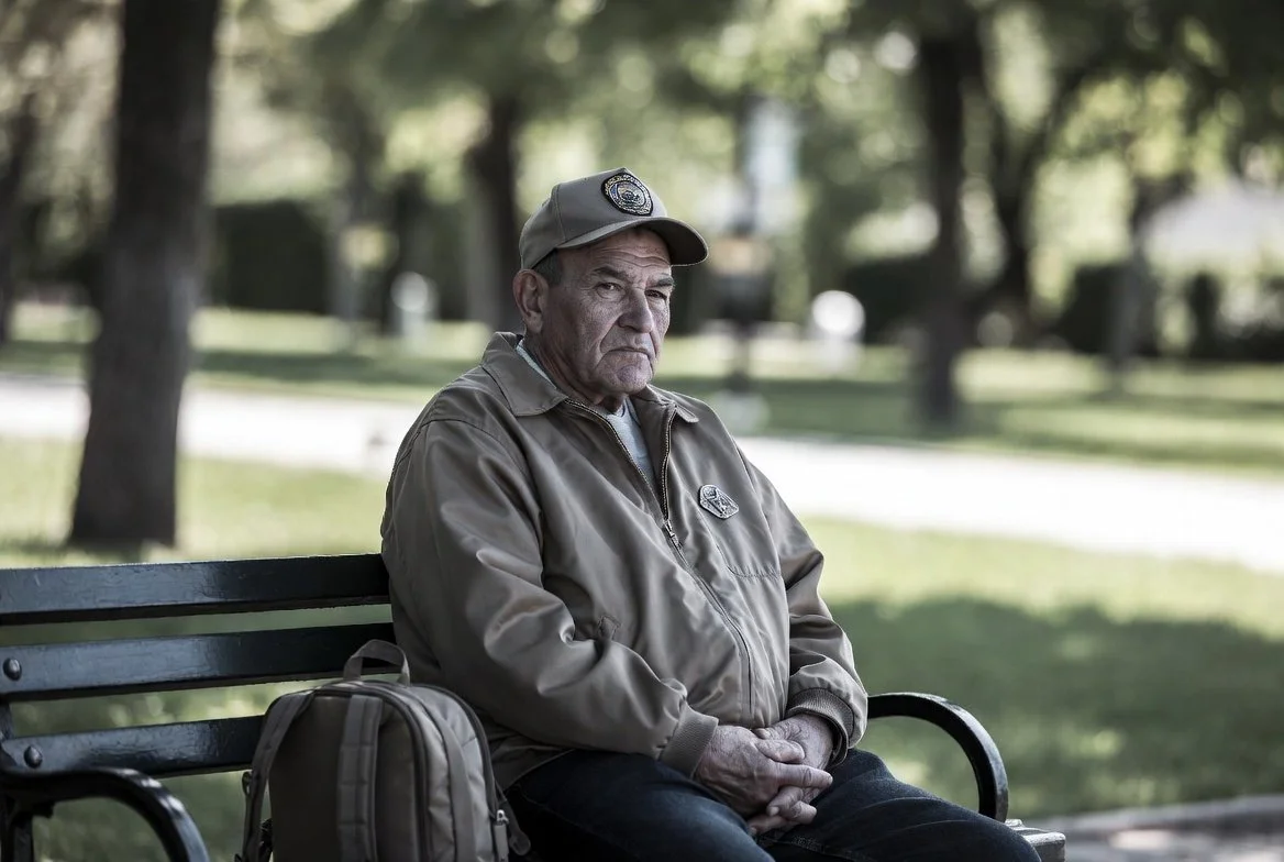 Veteran sitting on a park bench unsure of next move